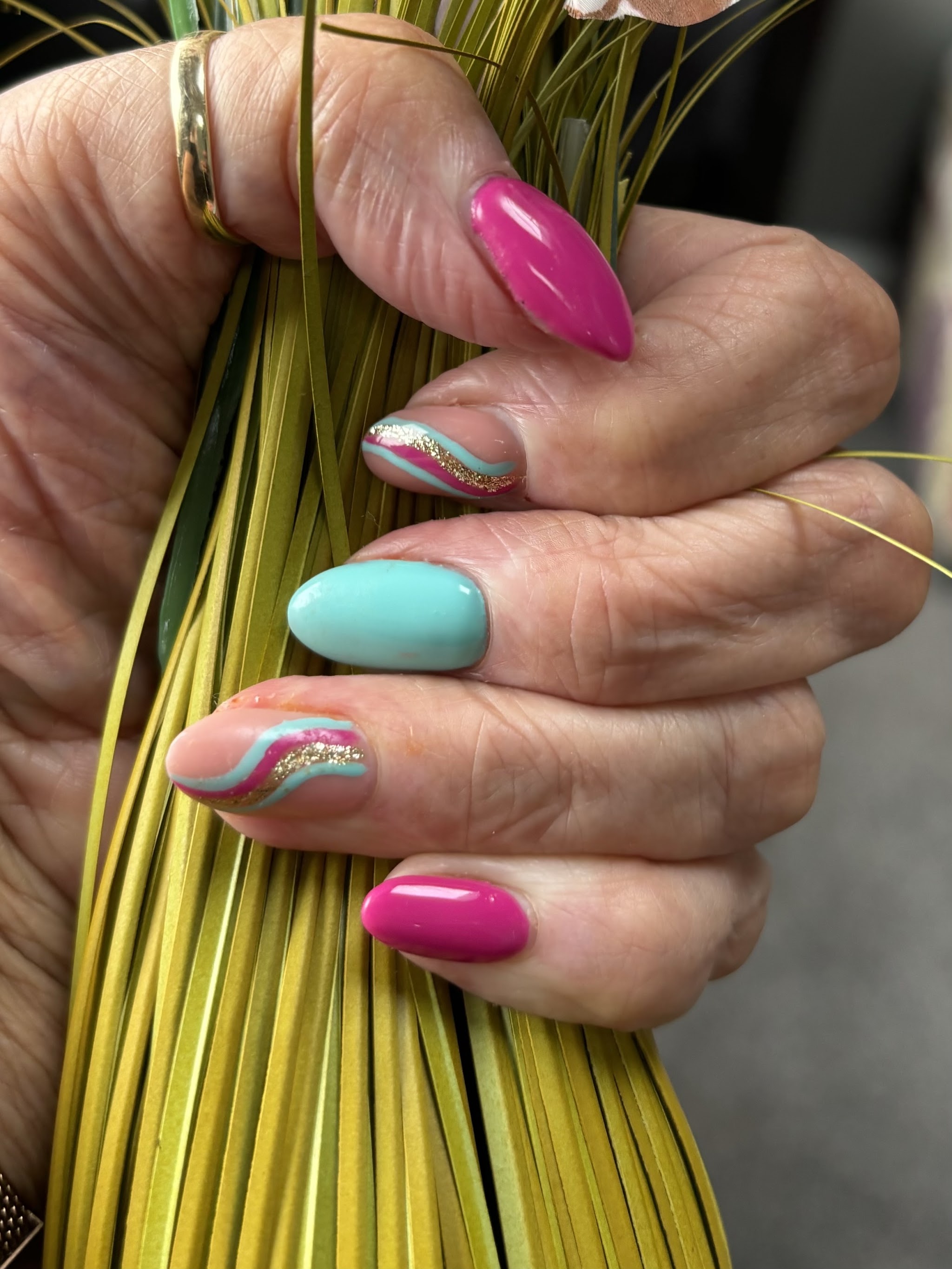 Almond nails in pink and turquoise with swirl art