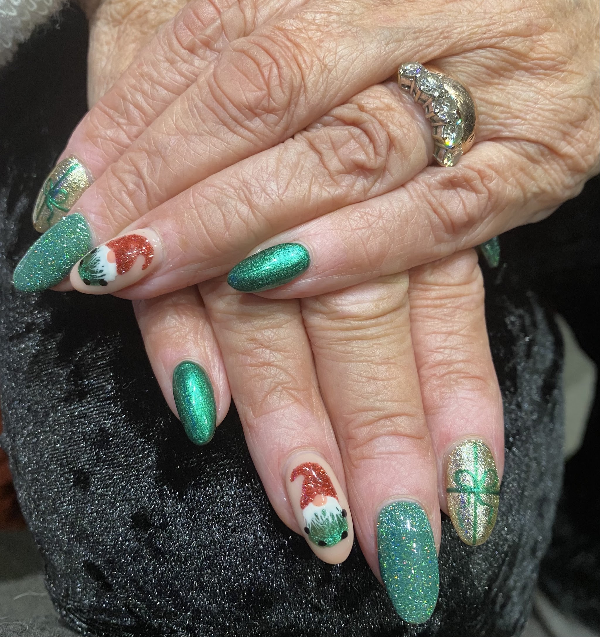 Green glitter Christmas nails with Santa and Grinch art